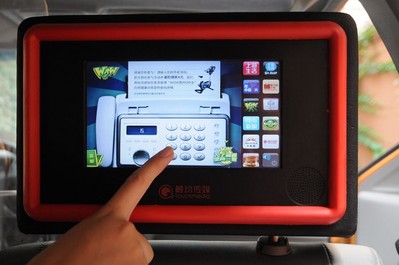 The passenger enters Mr. & Miss WOW 45 days challenge by inputting phone number on Touchmedia's in-taxi touchscreen